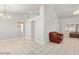 Bright living room featuring tile floors and a comfy leather chair at 5728 Palma Del Sol Way, Las Vegas, NV 89130