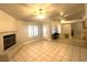 Spacious living room with fireplace and tile floors at 5728 Palma Del Sol Way, Las Vegas, NV 89130