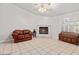 Living room featuring a fireplace and tiled floors at 5728 Palma Del Sol Way, Las Vegas, NV 89130