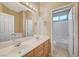 Double vanity bathroom with a separate shower and tub at 5892 Rothbury Ave, Las Vegas, NV 89141