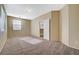 Spacious carpeted bedroom with large window and ceiling fan at 5892 Rothbury Ave, Las Vegas, NV 89141