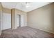 Carpeted bedroom with double door closet and ceiling fan at 5892 Rothbury Ave, Las Vegas, NV 89141