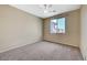 Bright bedroom featuring carpet, window, and ceiling fan at 5892 Rothbury Ave, Las Vegas, NV 89141