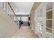 Bright entryway with tiled flooring, staircase, and glass french doors at 5892 Rothbury Ave, Las Vegas, NV 89141