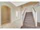 Two-story entryway with staircase and tile flooring at 5892 Rothbury Ave, Las Vegas, NV 89141