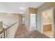 Upper level hallway with carpet, leading to bedrooms and bathroom at 5892 Rothbury Ave, Las Vegas, NV 89141