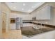 Modern kitchen with stainless steel appliances and granite island at 5892 Rothbury Ave, Las Vegas, NV 89141