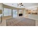 Living room with a view of kitchen, pool, and fireplace at 5892 Rothbury Ave, Las Vegas, NV 89141