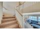 Upstairs hall with carpet and railing overlooking living area at 5892 Rothbury Ave, Las Vegas, NV 89141