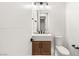 Clean bathroom with wood vanity and white walls at 6385 Leeland Ct, Las Vegas, NV 89149