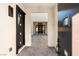 Elegant entryway with black doors leading to a courtyard at 6385 Leeland Ct, Las Vegas, NV 89149