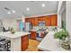 Well-equipped kitchen with an island and wood cabinets at 6452 Casamar St, North Las Vegas, NV 89086