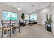 Open living and dining area with neutral tones and hardwood floors at 6452 Casamar St, North Las Vegas, NV 89086