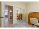 Bedroom with mirrored closet doors and home office at 6501 Grand Oaks Dr, Las Vegas, NV 89156