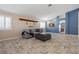 Spacious living room featuring a neutral color palette, tiled floors, and comfortable seating at 6501 Grand Oaks Dr, Las Vegas, NV 89156