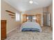 Large bedroom with king-size bed and built-in wood headboard at 6501 Grand Oaks Dr, Las Vegas, NV 89156