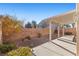 Covered patio with gravel yard and landscaping at 6501 Grand Oaks Dr, Las Vegas, NV 89156