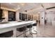 Stylish bar with an illuminated countertop, seating for four, and a decorative chandelier at 665 Overlook Rim Dr, Henderson, NV 89012