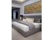Comfortable bedroom featuring a soft, upholstered bed, stylish bedside tables, and modern decor at 665 Overlook Rim Dr, Henderson, NV 89012