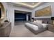Serene bedroom with sliding glass doors, a plush bed, and city views for ultimate relaxation at 665 Overlook Rim Dr, Henderson, NV 89012