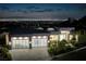 Stunning modern home with three-car garage boasts spectacular nighttime city views at 665 Overlook Rim Dr, Henderson, NV 89012