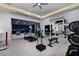Well-equipped home gym with modern equipment and stunning outdoor views at 665 Overlook Rim Dr, Henderson, NV 89012