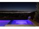 Night view of hot tub with city lights in background at 665 Overlook Rim Dr, Henderson, NV 89012