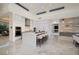 Modern kitchen boasts a waterfall island, sleek white cabinetry, and stainless steel appliances at 665 Overlook Rim Dr, Henderson, NV 89012