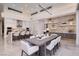 Modern kitchen and dining area with sleek white cabinetry and luxurious finishes at 665 Overlook Rim Dr, Henderson, NV 89012