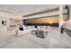 Bright, spacious living room featuring marble floors, modern furniture, and a stunning sunset view at 665 Overlook Rim Dr, Henderson, NV 89012