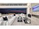 Spacious living room with sliding glass doors, fireplace, and city views at 665 Overlook Rim Dr, Henderson, NV 89012