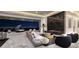 Contemporary living room features a fireplace, city views, and sleek furniture at 665 Overlook Rim Dr, Henderson, NV 89012