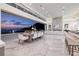 Spacious living room with floor-to-ceiling windows, marble floors and fireplace at 665 Overlook Rim Dr, Henderson, NV 89012
