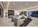 Open-concept living area with marble floors, multiple seating areas, and modern design at 665 Overlook Rim Dr, Henderson, NV 89012