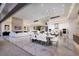 Open-concept living and dining area with floor-to-ceiling windows at 665 Overlook Rim Dr, Henderson, NV 89012