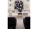 Bright office space with a large white desk, bold artwork, and elegant shelving creating an inspiring work environment at 665 Overlook Rim Dr, Henderson, NV 89012