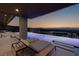 Relaxing poolside lounge area with a waterfall feature at 665 Overlook Rim Dr, Henderson, NV 89012