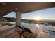 Luxury pool area with waterfall feature and lounge chairs overlooking scenic vistas at 665 Overlook Rim Dr, Henderson, NV 89012