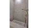 Modern shower stall with a linear drain and brushed nickel fixtures for a minimalist design at 665 Overlook Rim Dr, Henderson, NV 89012