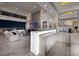 Modern wet bar with sleek cabinetry and a stunning marble backsplash at 665 Overlook Rim Dr, Henderson, NV 89012