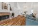 Open dining area with hardwood floors, chandelier, and large windows at 6908 Emerald Springs Ln, Las Vegas, NV 89113