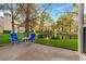 Serene patio overlooking a tranquil lake with two chairs at 6908 Emerald Springs Ln, Las Vegas, NV 89113