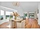 Light and airy dining area with hardwood floors and a chandelier at 6908 Emerald Springs Ln, Las Vegas, NV 89113