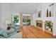 Bright living room with hardwood floors and a fireplace at 6908 Emerald Springs Ln, Las Vegas, NV 89113