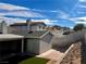 Backyard view of home with artificial turf and rock wall at 730 Brick Dr, Henderson, NV 89002