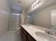 Clean bathroom with double vanity and a shower/tub combo at 730 Brick Dr, Henderson, NV 89002