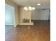 Dining area with hardwood floors and brick fireplace at 730 Brick Dr, Henderson, NV 89002