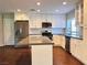 Modern kitchen with stainless steel appliances and an island at 730 Brick Dr, Henderson, NV 89002