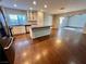 Modern kitchen with island, stainless steel appliances and hardwood floors at 730 Brick Dr, Henderson, NV 89002