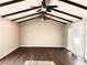 Spacious living area with wood floors, vaulted ceiling, and skylights at 730 Brick Dr, Henderson, NV 89002